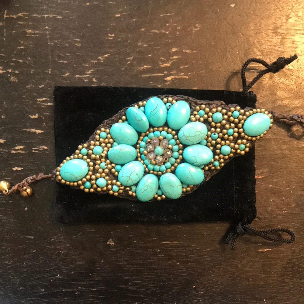 Super cute faux turquoise large woven bracelet.